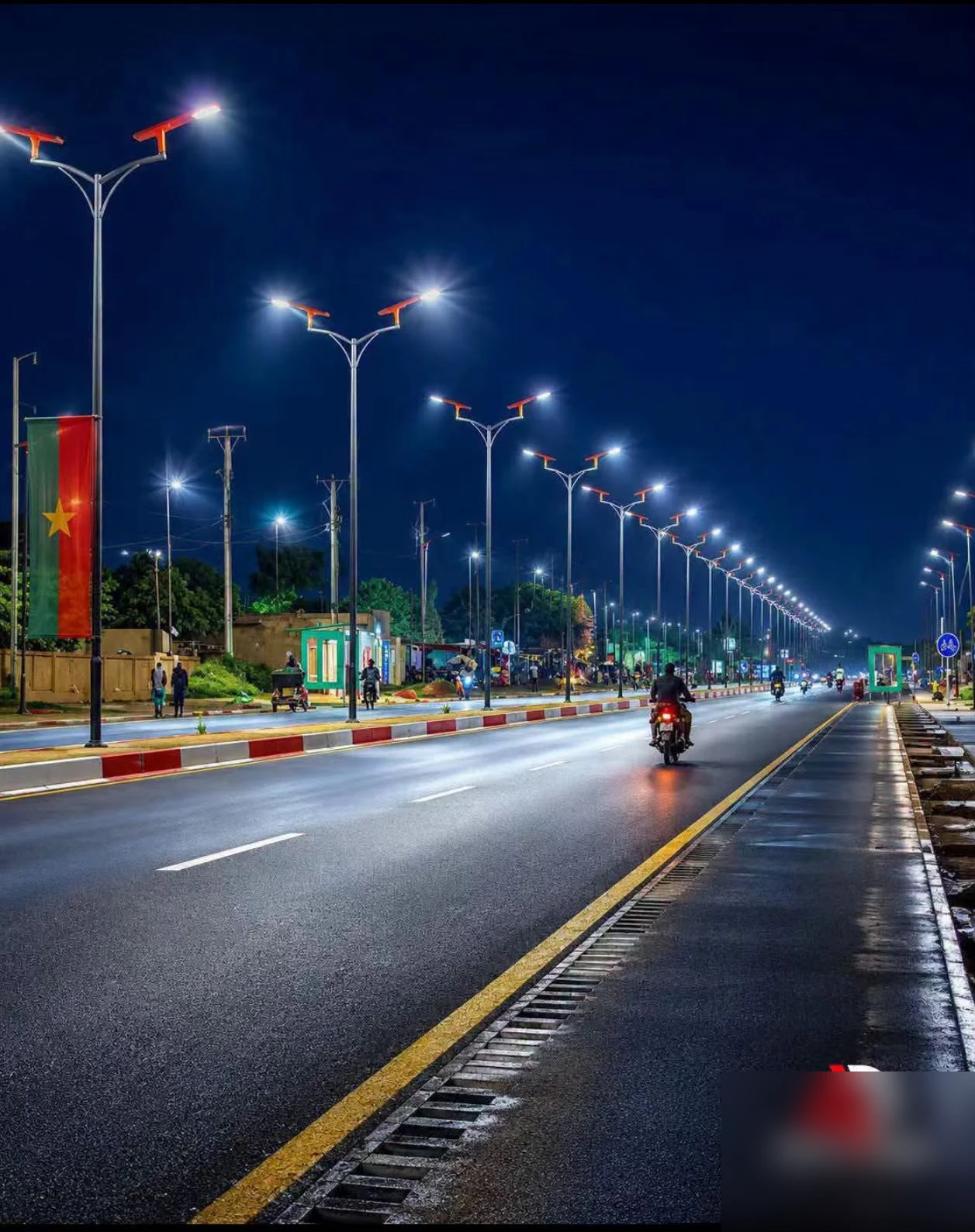 80W all-in-one solar street lights lighting a main boulevard in Burkina Faso at night