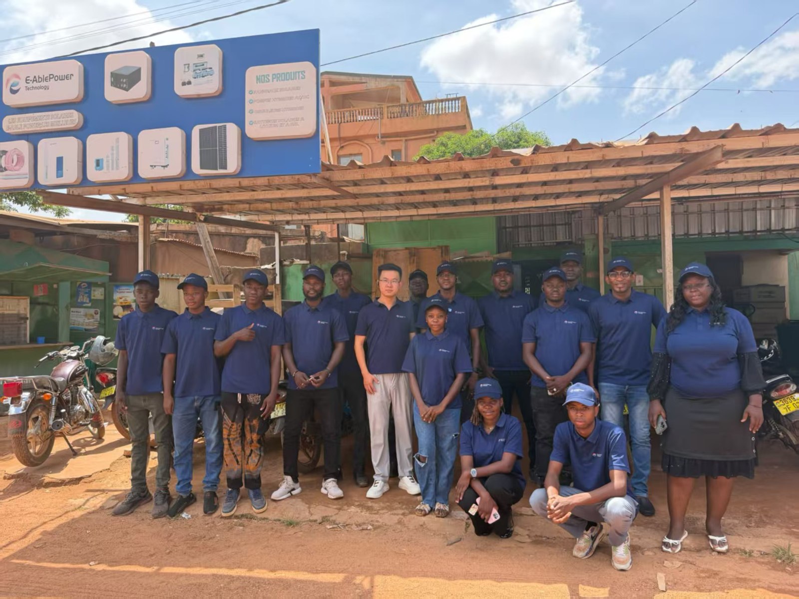 The local team together outside the E-AblePower-branded premises in Burkina Faso.
