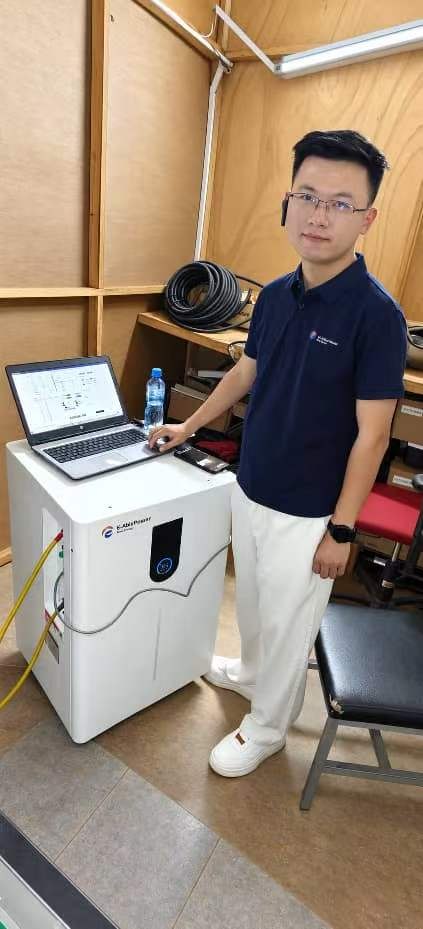 A laptop and energy storage unit at the site during the team visit.