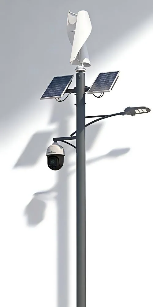 A tall grey pole with a wind turbine, two solar panels, a security camera, and an LED street light against a white background.